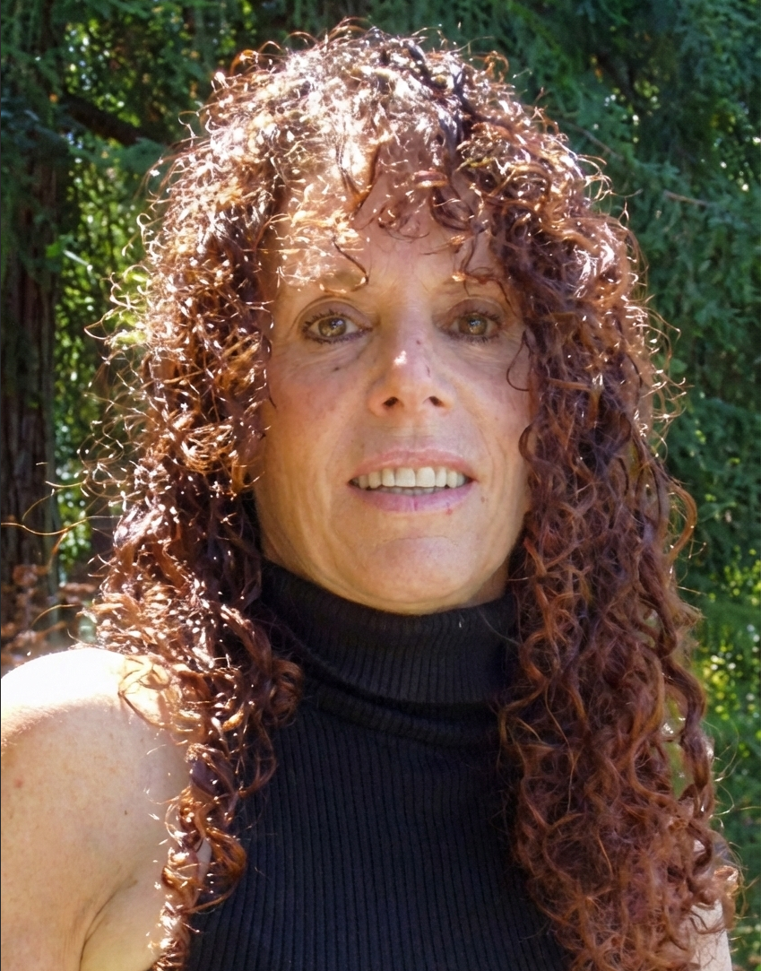 a lady with red hair and black turtleneck shirt.